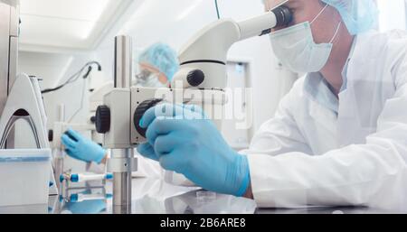 Lab technicians of scientists working on developing a vaccine Stock Photo