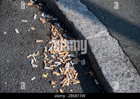 Used smoked cigarette stubs on rest area on Bundesautobahn 9, Germany. August 25th 2019 © Wojciech Strozyk / Alamy Stock Photo Stock Photo