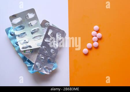 empty blister pack and pills on color background  Stock Photo