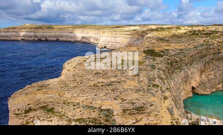 Flight over Dwerja Bay at the coast of Gozo Malta Stock Photo