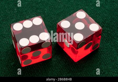 Red translucent dice. Throwing dice with spots of one to six on its sides. Stock Photo