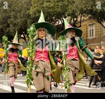 Rijeka, Croatia, February 23rd, 2020. Forest villas on the street. Beautiful and gorgeous woman masked as a fairies cheerful walking at the carnival Stock Photo