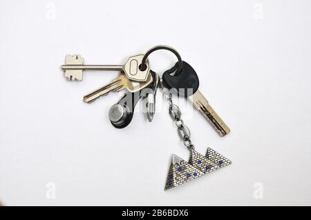 Bunch of keys with keyring from the apartment isolated on a white background. Stock Photo