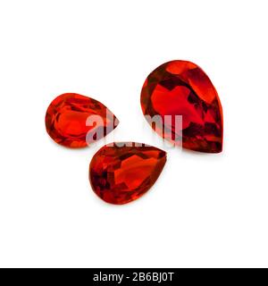 Three red gems on a white background. Pear facet red gemstones. Stock Photo