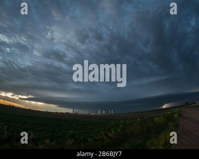 Supercell with cloud-to-cloud lightning, wall cloud and hail above a ...