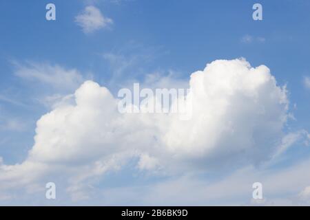 White curly clouds on a blue sky Stock Photo