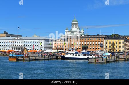 Market Square (Kauppatori) and South Harbor on background of Evangelical Lutheran cathedral of Diocese, in summer Stock Photo