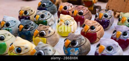 Lucky owls in bright colors made of ceramic. Photography in panoramic ...