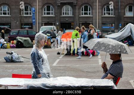 Flea market interrupted by rain at Hietalahti Market Square in Helsinki, Finland Stock Photo