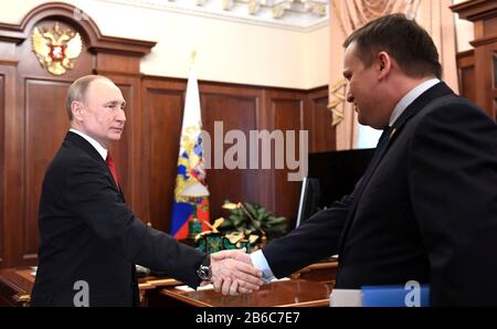 Moscow, Russia. 10th Mar, 2020. Russian President Vladimir Putin shakes hands with Novgorod Region Governor Andrei Nikitin before the start of a bilateral meeting at the Kremlin March 10, 2020 in Moscow, Russia. Credit: Alexei Nikolsky/Kremlin Pool/Alamy Live News Stock Photo