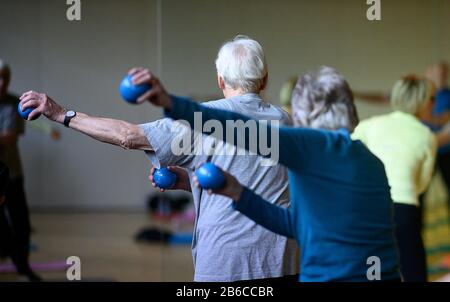 Stuttgart, Germany. 03rd Mar, 2020. Participants do an exercise with light weights during a sports lesson for people over 60. Credit: Sebastian Gollnow/dpa/Alamy Live News Stock Photo