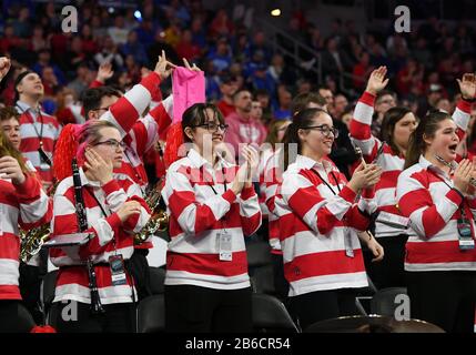 March 10, 2020: South Dakota Coyote school band members cheer for their team during the Summit League women's championship basketball game between the South Dakota State Jackrabbits and the South Dakota Coyotes at the Denny Sanford Premier Center, Sioux Falls, SD. South Dakota defeated South Dakota State 63-58 and move on to the NCAA tournament. Photo by Russell Hons/CSM Stock Photo