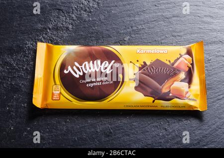 Wawel chocolate bar on stone background. Wawel is polish confectionery company, producing chocolates, wafers, snacks founded in 1898 in Krakow, Poland Stock Photo