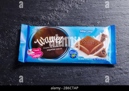 Wawel chocolate bar on stone background. Wawel is polish confectionery company, producing chocolates, wafers, snacks founded in 1898 in Krakow, Poland Stock Photo