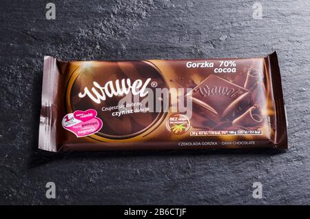 Wawel chocolate bar on stone background. Wawel is polish confectionery company, producing chocolates, wafers, snacks founded in 1898 in Krakow, Poland Stock Photo