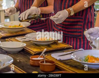 Touris at cooking class learn to make Tzatziki dip Stock Photo