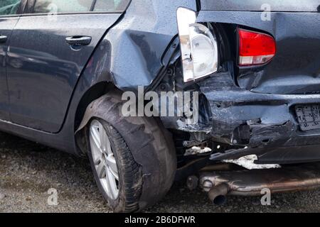 Damaged rear of a car caused by an accident Stock Photo