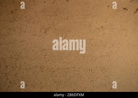 A wall made of ecologically sustainable clay plaster Stock Photo