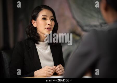Human resources manager conducting job interview with applicants in office Stock Photo