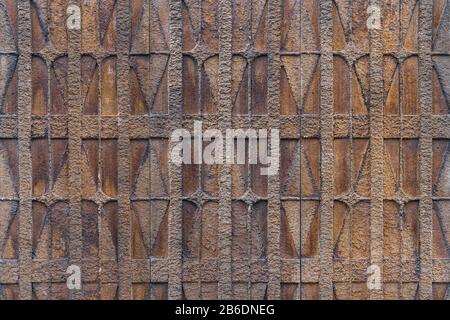 Textured background of a decorative geometric motifs on a wall Stock Photo