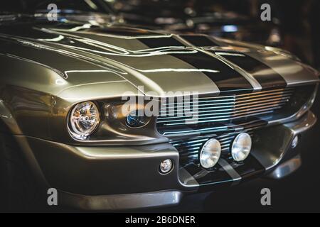 Front-side details of the grille and headlamps of a classic sports car from 1967 Stock Photo