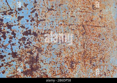 Textured rusted iron wall background. Multiply rusty stains and scratches on old gray paint Stock Photo
