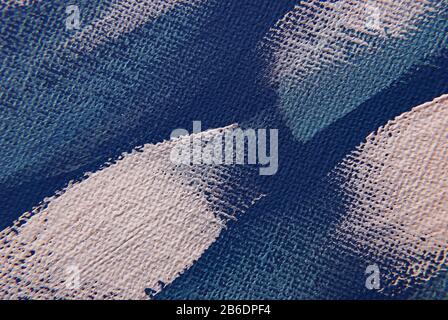 blue painted canvas background with white abstract strokes Stock Photo