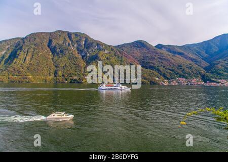 Boats on Lake of Como in Lombardy, Italy, at sunset Stock Photo