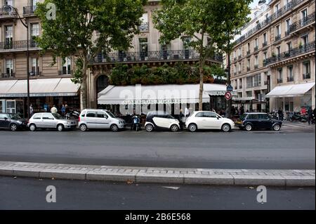 Cars parked in front of a cafe, Cafe de Flore, Boulevard St. Germain, Paris, Ile-de-France, France Stock Photo