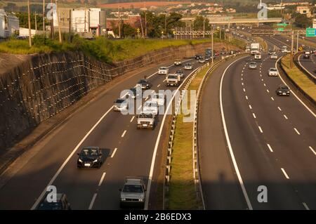 heavy oncoming traffic on multi lane highway Stock Photo