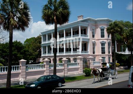 Carriage with tourists in front of a house, East Battery Street, Charleston, South Carolina, USA Stock Photo