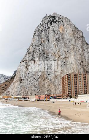 People on beach with Rock of Gibraltar Stock Photo