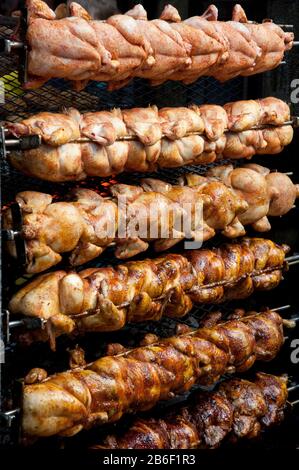Chickens being cooked on rotisserie during festival day, Melk, Lower Austria, Austria Stock Photo