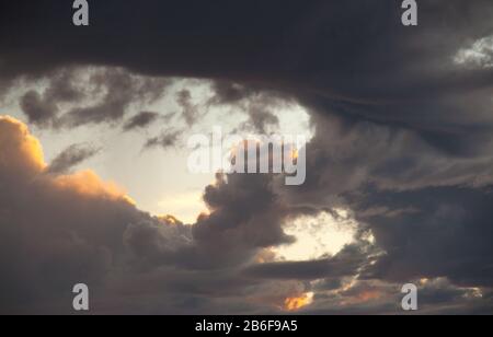 Stormy clouds with blue sky and light from the heavens Stock Photo