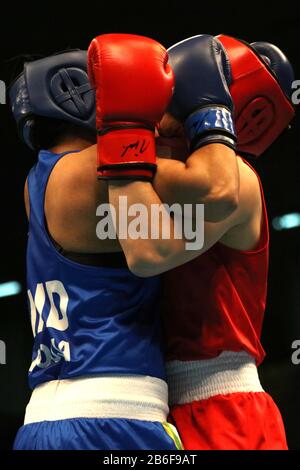 Amman, Jordan. 10th Mar, 2020. Li Qian (R) of China competes with Pooja Rani of India during their Women's Middleweight (69-75kg) semifinal at the Asian/Oceanian Boxing Qualification Tournament for 2020 Tokyo Olympic Games in Amman, Jordan, March 10, 2020. Credit: Mohammad Abu Ghosh/Xinhua/Alamy Live News Stock Photo