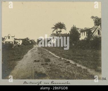 In the outskirts of Paramaribo (title object) View of a road through the outskirts of Paramaribo. Part of the album Souvenir de Voyage (Part 2), about the life of the Doijer family in and around the plantation Ma Retraite in Suriname during the years 1906-1913. Manufacturer : Photographer: Hendrik Doijer (attributed to) Place manufacture: Suriname Date: 1906 - 1913 Physical features: gelatin silver print material: paper Technique: gelatin silver print dimensions: photo: h 86 mm × W 110 mm Date: 1906 - 1913 Stock Photo
