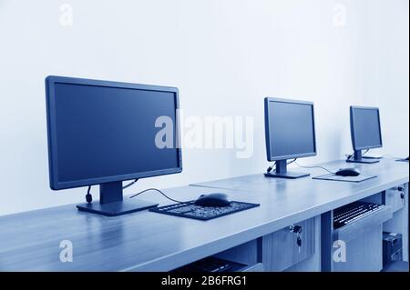 Computer Lab, Neatly placed rows of computers. Stock Photo