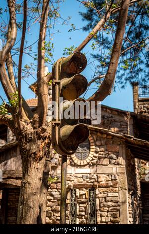 Old rusty and grungy street semaphore with spider webs on it. Stock Photo