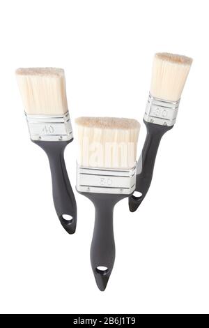 three paintbrushes on white. Stock Photo