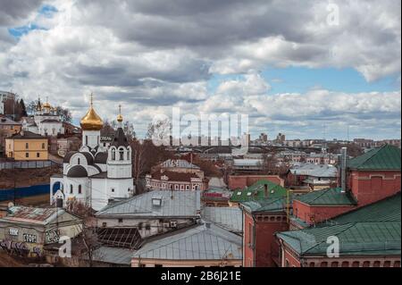 NIZHNY NOVGOROD, RUSSIA - APRIL, 23, 2017: View on Volga river Bed and Breakfast N.A. Bugrov and Church in honor of the icon of the Kazan Mother of Go Stock Photo
