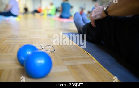 Stuttgart, Germany. 03rd Mar, 2020. During a sports lesson for people over 60, glasses are placed next to two balls. Credit: Sebastian Gollnow/dpa/Alamy Live News Stock Photo