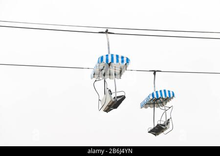 Two cable car with white and blue stripe design Stock Photo