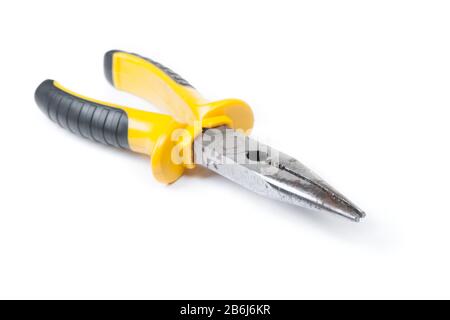 Old pliers with yellow handle isolated on white background Stock Photo