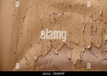 Cracked beige leather texture. Background in bad condition. Stock Photo