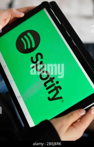 Bordeaux , Aquitaine / France - 11 30 2019 : logo of Spotify screen tablet hands holding smartphone Stock Photo