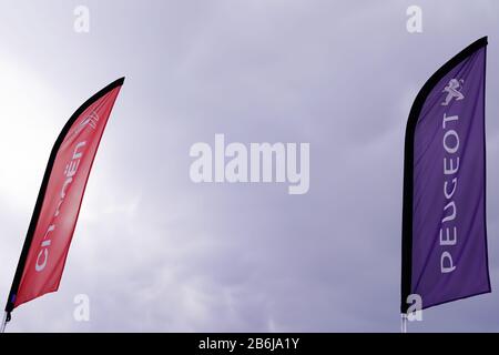 Bordeaux , Aquitaine / France - 10 30 2019 : Citroen Peugeot car flag dealership automobiles in wind psa group Stock Photo