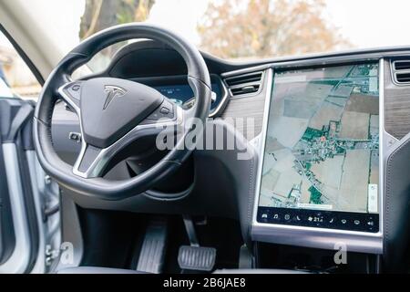 Bordeaux , Aquitaine / France - 11 30 2019 : tesla digital dashboard on electric car model s steering wheel Stock Photo