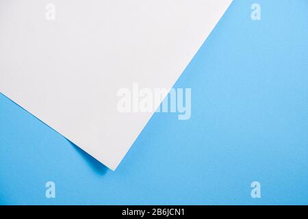 white torn paper with blue background, ready for design Stock Photo