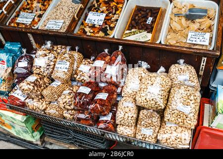 VIENNA, AUSTRIA, 23 MARCH 2017: Market stall with various dried fruits and nuts at the Naschmarkt most popular center food market in Vienna Stock Photo