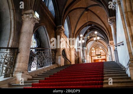 VIENNA, AUSTRIA - MARCH 23, 2017: Staircase of Vienna City Town Hall or Rathaus, panoramic indoors view of the landmark Stock Photo